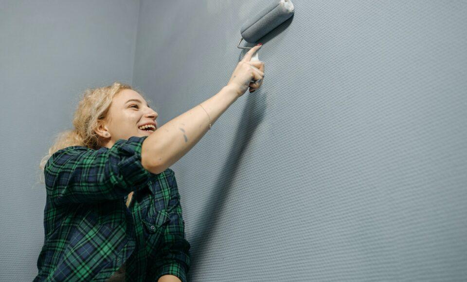 Woman Painting Wall with a Paint Roller