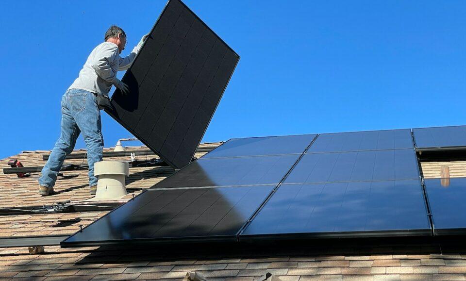 Man Installing Solar Panels